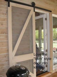 an open sliding glass door with the words love the barn style door in front of it