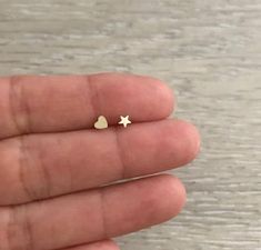 Teeny Tiny STAR Studs. They are super cute! * 1 pair * 14k Gold & Gold Filled * Star Size: 3.5 mm * Made in U.S.A. Tiny Gold Star Cartilage Earrings, Dainty Star Cartilage Earrings Gift, Minimalist Bangle Bracelets, Wide Gold Ring, Minimalist Bangle, Gold Heart Stud Earrings, Hammered Gold Ring, Earring Cartilage, Gold Heart Studs