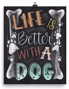 a chalkboard sign that says life is better with a dog