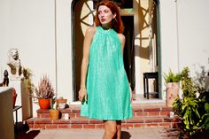 Unleash your inner Factory Girl in this amazing 1960s party dress! This dress features a chic tent cut with a mock neck. The fabric is a beautiful green with silver polka dots. It is fully lined. A metal zipper closes up the back. Great vintage condition! Fits up to a 40 inch bust 35 inches long Shown on a size extra small In person shopping available at our downtown Los Angeles showroom. Summer Party Dresses In Mod Style, Mod Spring Party Dress, Mod Style Spring Party Dresses, Mod Style Party Dresses For Spring, Go Go Dress, 1960s Party, Gogo Dress, Mock Neck Dress, Tent Dress