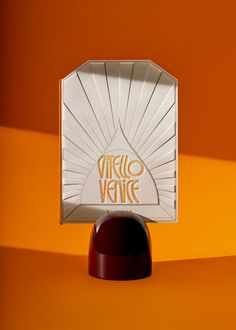 a white box with the words virgo venice on it sitting on top of a stand