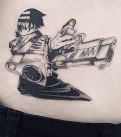 the back of a woman's stomach with an anime tattoo on it