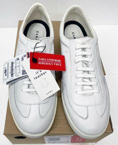 You are bidding on a NEW pair of ZARA White UNIFORM LEATHER TENNIS SNEAKERS model 1999201001. NEW in box. Woman's Size USA 8, UK 6 and EU (Europe) 39. The pictures are an important part of the description. GUARANTEED to be as stated. Buyer pays shipping from 91401 zip.   I do not falsify customs forms and I declare the full auction value of the item. Custom Tax are the buyer's responsibility. I ship via UPS, USPS and other carrier of your choice.   All photos shown are of actual item taken just Zara Casual Leather Sneakers, Zara Sneakers For Spring Streetwear, Zara Leather Sneakers, White Uniform, I Declare, Zara Sneakers, Tennis Sneakers, Zara White, Superga Sneaker