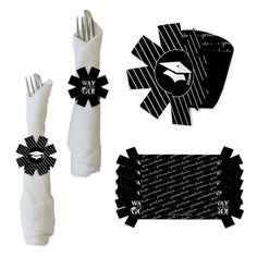 an assortment of black and white items including napkins, scissors, and paper tags