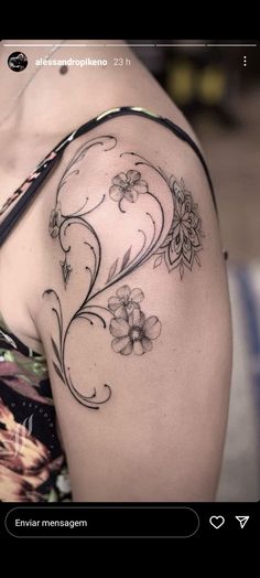 a woman with a flower tattoo on her arm