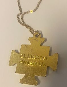 You are purchasing a very nice either gold tone or & silver tone medium size cross of Saint Michael the Archangel. Approximate size: 1.5" x 1.5" Chain is 18" in length flat cable chain. Comes in an acrylic box, ready to be given as a gift or for safe keeping. Please see pictures for details. Carry this cross with you as a reminder that Saint Michael the Archangel is the defender of evil, and with his intercession we can keep evil away. ********************************************************** I