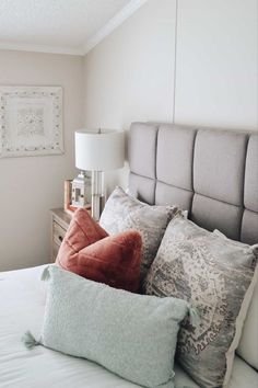 Gray upholstered headboard with throw pillows and white comforter Gray Upholstered Bed, Headboard Design, Beds And Headboards, Headboard Designs, Upholstered Bed, Wooden Furniture, Aesthetic Bedroom, Upholstered Beds, Queen Size Bedding