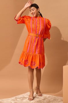 Orange dress with zig-zag lace work, floral cutwork motifs, puff sleeves and scallop hem. Paired with belt.
Component: 2
Embroidered
Neckline: Mandarin
Sleeve Length: Three quarter
Fabric: Cotton
Color: Orange
Front buttons
Scallop hem
Puff sleeves - Aza Fashions Lace Applique Dress, Floral Cutwork, Scallop Hem, Embroidered Neckline, Cotton Embroidery, Applique Dress, Scalloped Hem, Cut Work, Orange Dress