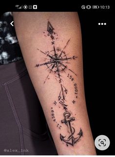 a man's arm with an anchor and compass tattoo on the left side of his arm