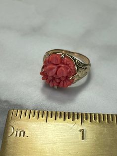 ". Coral carved into flowers and clover! This is an antique Victorian ring. Signed \"Bulova NY PAT\" Maybe Bulova watch co was making jewelry 120 years ago? Made in 14k yellow gold that has the slightest pink hue typical of gold from the late Victorian era. The tips of the flowers have tiny chips at the outside edges, please zoom in on the pics to see. They are really only noticeable with the loupe, doesn't detract at all. Size 6 1/2 5.76 grams 14k gold and coral Bulova NY PAT Circa 1900" Victorian Pink Hallmarked Ruby Ring, Antique Orange Oval Jewelry, Coral Oval Cabochon Jewelry, Antique Rings Victorian, Vintage Coral Oval Jewelry, Victorian Flower-shaped Collectible Jewelry, Victorian Ring, Coral Ring, Victorian Rings