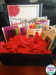 a black basket filled with lots of school supplies