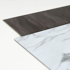 two different types of marble are shown on the counter top, one is black and white