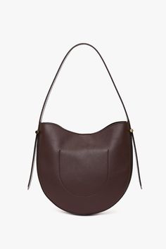 Elevate your everyday style with the Victoria Beckham Hobo Bag in burgundy, where timeless sophistication meets practical design. Crafted from the finest supple leather, this bag offers a relaxed silhouette that embodies understated luxury. Its slouchy, yet structured shape drapes beautifully whether worn over the shoulder or carried by hand, offering a versatile, casual-chic look. Victoria Beckham Medium Dia Hobo Bag In Burgundy Smooth Leather  - Size ONE SIZE UK Brown Smooth Grain Hobo Bag For Work, Timeless Brown Hobo Shoulder Bag, Burgundy Shoulder Bag With Gold-tone Hardware For Office, Office Burgundy Shoulder Bag With Gold-tone Hardware, Chic Burgundy Bag With Leather Lining, Burgundy Leather Shoulder Bag For Office, Burgundy Top Handle Shoulder Bag For Business, Luxury Burgundy Bags For Work, Modern Burgundy Shoulder Bag With Soft Leather