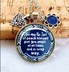 "Scripture Necklace, Christian jewelry for women, Gift for women, Bible Verse Necklace, faith jewellery This beautiful necklace have a blue background and it comes with 2 charms as in the picture. quote reads: \" Now may the Lord of peace himself give you peace at all times and in every way.\" 2 Thessalonians 3: 16   Pendant is silver colour, 30 mm in size.  the chains are: - 24 inches long, cable chain stainless steel - 30 inches long, ball chain stainless steel please do not swim or shower wit Blue Personalized Inspirational Jewelry, Inspirational Blue Jewelry For Gifts, Inspirational Blue Jewelry As A Gift, Spiritual Blue Jewelry For Mother's Day, 2 Thessalonians 3 16, Christian Jewelry For Women, Scripture Necklace, Verse Necklace, Bible Verse Necklace