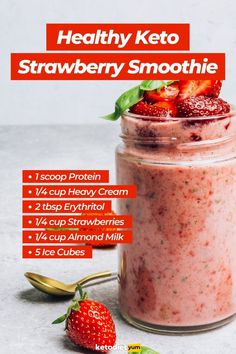 healthy keto strawberry smoothie recipe in a jar with strawberries on the side