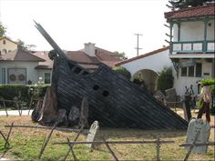 an old wooden pirate ship is in the yard