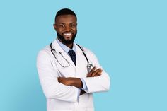 a man with a stethoscope standing in front of a blue background wearing a white coat and tie