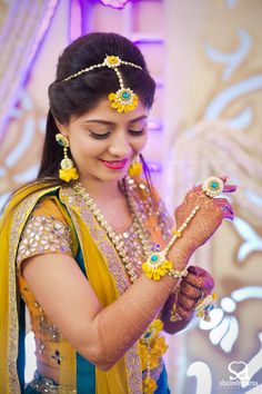 Photo of Yellow and Blue Floral Jewellery for Haldi and Mehendi Flower Jewellery For Haldi, Flower Jewellery For Mehndi, Fresh Flower Jewelry, Flower Jewelry Designs, Wedding Flower Jewelry, Indian Wedding Photography Couples