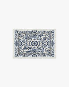 a blue and white rug with an ornate design