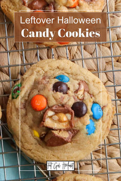 a close up of a cookie on a cooling rack with the words leftover halloween candy cookies