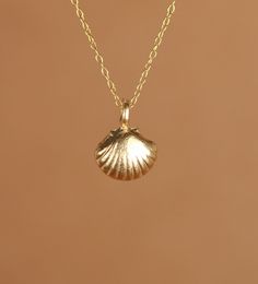 Seashell necklace in gold, beachy necklace, silver sea shell pendant, boho necklace, summer jewelry, gold shell jewelry, tropical gift A cute and easy to wear 14k gold vermeil sea shell hangs from a 14k gold vermeil chain in the length of your choice! This beauty is also available in sterling silver and the shell measures 8mmx10mm. Looking for other charm necklaces? https://www.etsy.com/shop/BubuRuby?section_id=12318467 More from BubuRuby? https://www.etsy.com/shop/BubuRuby?ref=seller-platform-m Dainty Necklaces For Vacation, Sterling Silver Shell Necklace For Beach, Dainty Shell Charm Necklace For Beach, Dainty Shell Jewelry For Beach, Beachy Gold Shell-shaped Jewelry, Gold Shell Necklaces For Beach, Beachy Gold Shell-shaped Necklaces, Beachy Gold Shell Necklace As A Gift, Beachy Gold Shell Necklace For Gifts