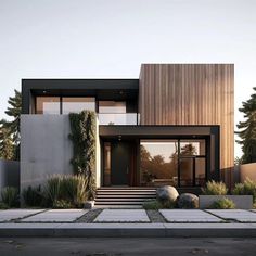 a modern house with an entry way leading to the front door