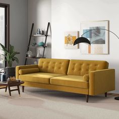 a living room with a yellow couch and coffee table