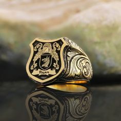 Coat of Arms Ring, Personalized Signet Ring, Customized Ring, Raised Family Celtic Ring, Crest Ring Gift, Gold Coated Family Crest Ring Gift Product Details: ✅Material: 925 Sterling Silver, Gold Coating,  Black Rhodium Coating ✅Ring Size: Available in various sizes (please refer to our sizing chart) ✅Handmade with exceptional craftsmanship ✋🎨 ✅ Dimensions:  19x19mm   /   ±18gr 🛡️ Discover our custom coat of arms jewelry, a symbol of heritage made uniquely yours! 🌟💍 Choose your family crest and let us bring it to life with expert craftsmanship. 🖌️✨ Our artisans create stunning pieces in silver, gold coating, or rhodium coating, tailored to your preferences. 💫🔒 With attention to detail and a touch of elegance, our jewelry collection includes signet rings, pendants, and bracelets, each Customizable Luxury Promise Ring, Luxury Customizable Promise Ring, Luxury Customizable Rings For Anniversary, Engraved Gold Emerald Ring As A Gift, Custom Personalized Rings For Formal Occasions, Custom Yellow Gold Ring For Formal Occasions, Custom Yellow Gold Rings For Formal Occasions, Gold Engraved Emerald Ring Gift, Custom Hallmarked Signet Ring For Wedding