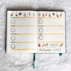 an open notebook with stickers and writing on the pages that read october, fall, and autumn leaves