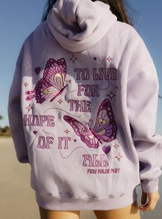 The "To Live For the Hope of it All" Oversized Hoodie is crafted from top-quality fabrics, while having an exquisite embroidery art of fine-detailed butterflies. The PPP palm embroidered above our hearts is a symbol of unity within the Pink Palm Puff community, reminding us all of the love we share. Pink Palm Puff Hoodie Purple, Hoodie Collection Aesthetic, Hoodie Wishlist, Preppy Sweatshirts, Inspiring Message, Xmas List, Cozy Fabric, The Hope, Bright Side