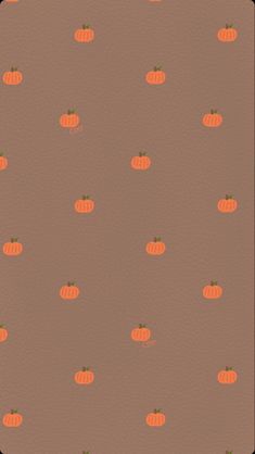 an orange and brown background with small pumpkins