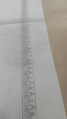 an image of a drawing on paper with lines drawn in the middle and one line at the end