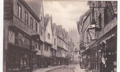 an old black and white photo of a city street