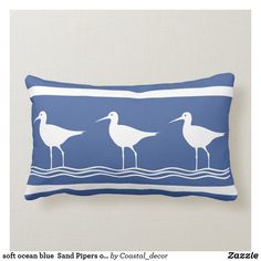 three seagulls in the water on a navy blue and white striped throw pillow