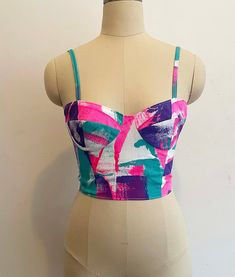 This piece is a unique hand printed fitted bodice.  It is designed to be form fitting and has corset strapping in the back to ensure the piece can be fitted perfectly on anybody.  Brightly colored and hand printed, no two pieces are ever the same.  Sizing is standardized but I am happy to alter and personalize pieces, send me a msg when you order and we can talk about sizing Fitted Multicolor Tops With Adjustable Straps, Multicolor Fitted Tops With Adjustable Straps, Fitted Multi-color Tops With Adjustable Straps, Sleeveless Multicolor Party Corset, Multicolor Sleeveless Corset For Party, Sleeveless Multicolor Corset For Parties, Multicolor Summer Party Corset, Summer Party Multicolor Corset, Summer Overbust Crop Top With Corset Back