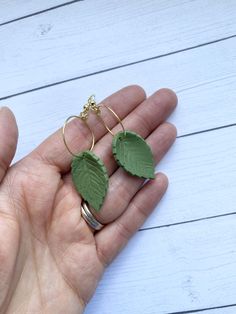 "These polymer clay leaf pieces are 1\" long hanging on a hoop. The green and yellow color are unique and mixed by me. They are lightweight and organic with the leaf vein pattern. Nicklefree earwires." Everyday Green Lever Back Earrings, Green Polymer Clay Earrings With Ear Wire, Green Hypoallergenic Polymer Clay Earrings, Hypoallergenic Green Polymer Clay Earrings, Green Nature-inspired Everyday Earrings, Everyday Green Nature-inspired Earrings, Handmade Green Leaf-shaped Earrings, Green Leaf-shaped Earrings, Leaf Polymer Clay Earrings