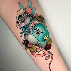 a tattoo with an image of a rat holding a jar