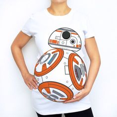 a pregnant woman wearing a star wars t - shirt