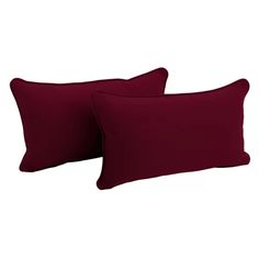 two red pillows sitting next to each other