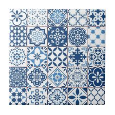 a blue and white tile pattern with many different designs on the tiles, all in different colors