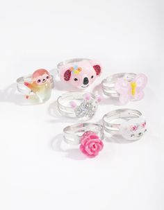 a collection of rings with animals and flowers on them