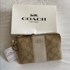 Light Khaki/Chalk Leather Wristlet Nwt. Signature Coated Canvas With Refined Calf Leather Two Credit Card Slots Zip-Top Closure, Fabric Lining Detachable Wrist Strap 7 1/2" (L) X 4 3/4" (H) Coach Beige Bag With Zipper Pouch, Cream Coin Purse For Daily Use, Chic Beige Wallets Perfect For Gifts, Elegant Coach Beige Coin Purse, Elegant Beige Coach Wristlet, Coach Beige Coin Purse For Daily Use, Coach Beige Pouch Wristlet, Beige Coach Coin Purse, Beige Coach Pouch Wristlet