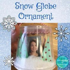 a snow globe ornament with a woman's face in it