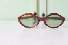 "1970s RARE Deadstock Sunglasses Wonderful vintage condition Very rare deadstock Tinted Lens as seen in picture non-prescription amazing style true vintage 5.75\"total width 2.5\"lens width 5.75\"arms length Thank YOU and please feel free to ask me any ?s:) Have a lovely day xoxo www.etsy.com/shop/retroandme #SUNDAY" Retro Brown Cat Eye Sunglasses With Mirrored Lenses, Vintage Brown Cat Eye Sunglasses With Gradient Lenses, Retro Brown Sunglasses With Uv Protection, Retro Brown Cat Eye Sunglasses With Gradient Lenses, Vintage Brown Sunglasses For Summer, Vintage Brown Cat Eye Sunglasses With Polarized Lenses, Retro Brown Sunglasses With Mirrored Lenses, Vintage Brown Cat Eye Sunglasses With Uv Protection, Retro Brown Cat Eye Sunglasses With Uv Protection