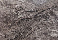 a close up view of a granite countertop with black and white streaks on it