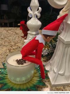 an elf is sitting on top of a bowl