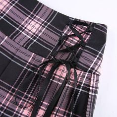 This Gothic Pink Stripe Mini Skirt is made of a soft, comfortable fabric that ties around the waist for the perfect fit. This sweet mini skirt is the perfect go-to outfit for a night out or day in. It's made of a shiny, soft fabric that you'll love to wear on those cool days. The One Piece features a cute black, grey, and pink that is so easy to wear in the summertime paired with some strappy heels for an effortlessly chic look! Please check out our size chart carefully Estimated Time of Deliver Fitted Mini Skirt With Tie Waist, Pastel Goth Skirt, Goth Skirts, Pink Plaid Skirt, Goth Skirt, Red Plaid Skirt, Plaid Pleated Skirt, Plaid Mini Skirt, Pink Plaid