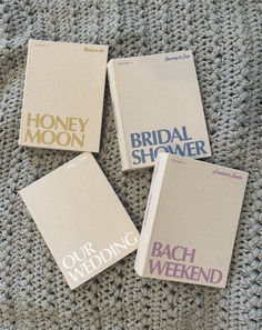 four books sitting on top of a gray carpet next to each other with the words bridal shower written on them