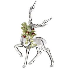 an ornament that is shaped like a deer with berries on its antlers