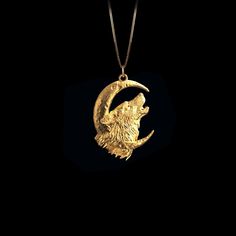 Unleash your wild spirit with our wolf and moon pendant. This striking piece captures the wolf's raw energy beneath a glowing moon, symbolizing freedom and strength. A beautiful reminder of resilience and the untamed beauty of nature. 𝗣𝗲𝗻𝗱𝗮𝗻𝘁 𝗱𝗲𝘁𝗮𝗶𝗹𝘀 This pendant is crafted in real solid gold. * Made in USA * 𝗛𝗲𝗶𝗴𝗵𝘁: 1.15" (29.5 mm) x 𝗪𝗶𝗱𝘁𝗵: 0.8" (20 mm)  *not including the bail dimensions * 𝗠𝗮𝘁𝗲𝗿𝗶𝗮𝗹: 14K and 18K solid gold * 𝗙𝗶𝗻𝗶𝘀𝗵: polished * 𝗪𝗲𝗶𝗴𝗵𝘁: Approximately 6 grams  * 𝗕𝗮𝗶𝗹: fits chains up to 4 mm thick * 𝗦𝗼𝗹𝗶𝗱: This pendant has a solid back (not hollow) * 𝗔𝘂𝘁𝗵𝗲𝗻𝘁𝗶𝗰𝗶𝘁𝘆: Each order includes a Certificate of Authenticity * 𝗣𝗮𝗰𝗸𝗮𝗴𝗶𝗻𝗴: Delivered in our elegant jewelry box * 𝗖𝗵𝗮𝗶𝗻: Shown on model with a 20-i Wolf And Moon, Glowing Moon, Wild Spirit, Wolf Moon, Solid Gold Chains, The Untamed, Moon Pendant, Box Chain, Elegant Jewelry